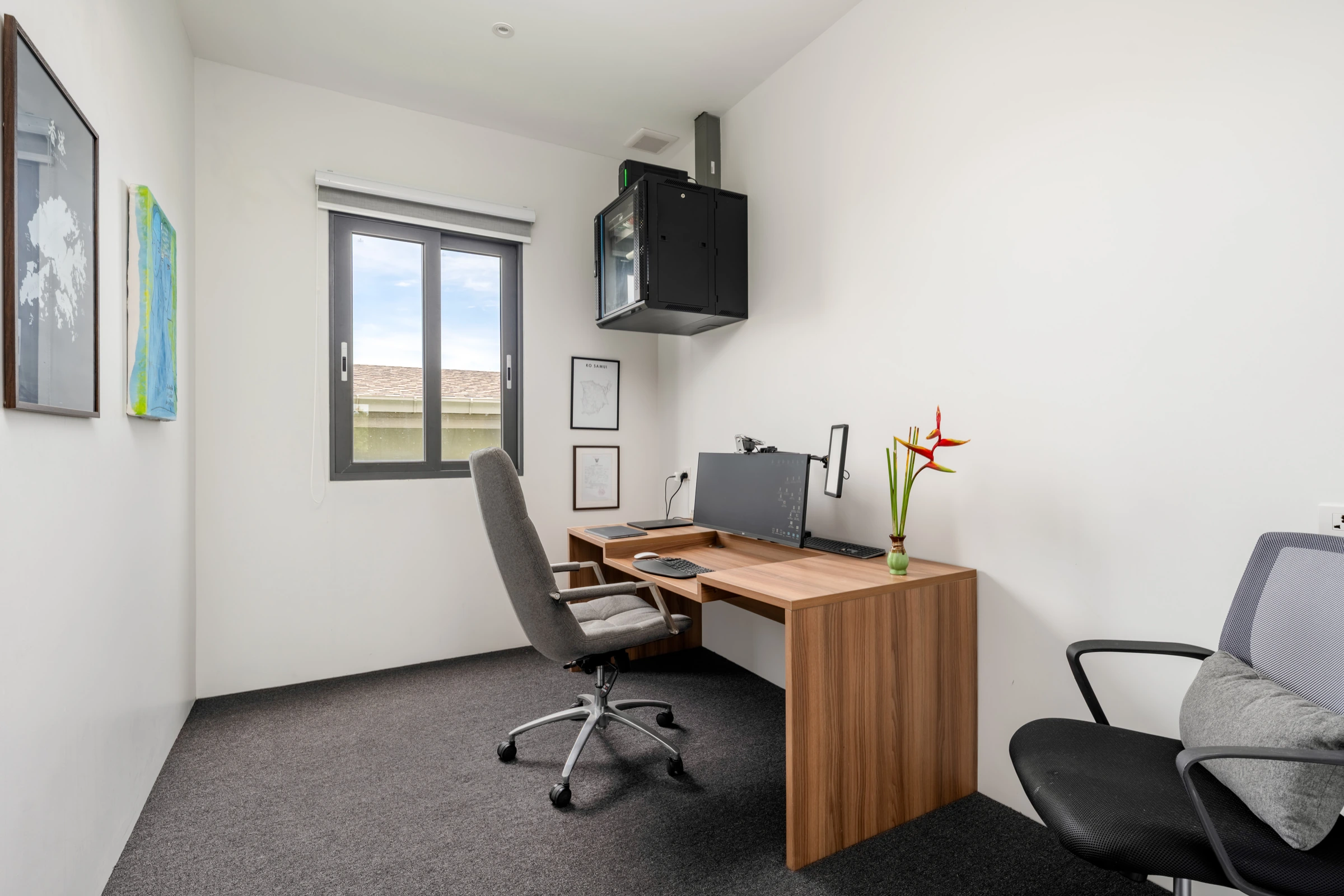 Private office with desk, monitor and windows