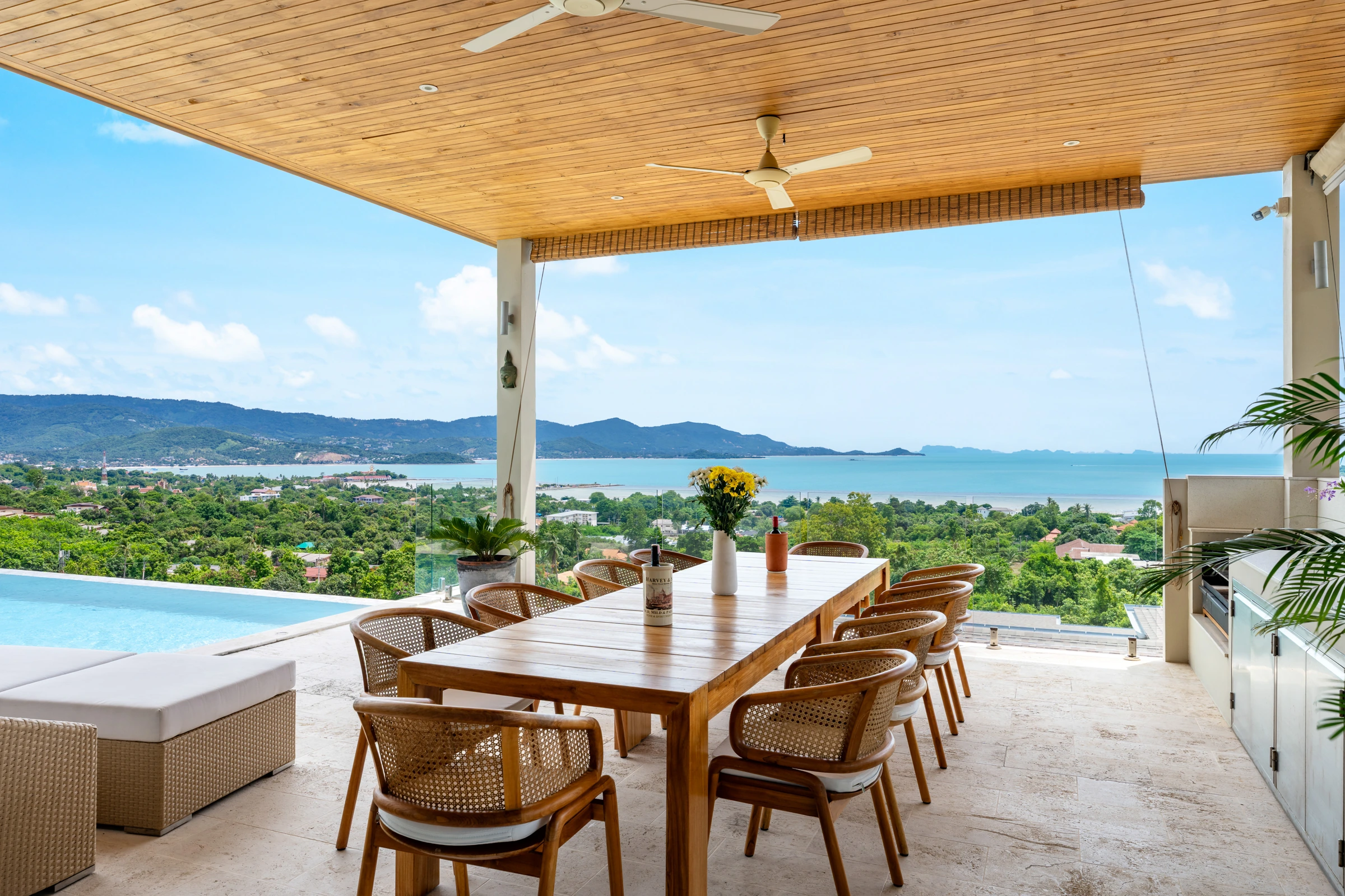 A table set for a shared meal on the sea-facing terrace